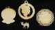Three Ivory Carved Pendants and a Miniature