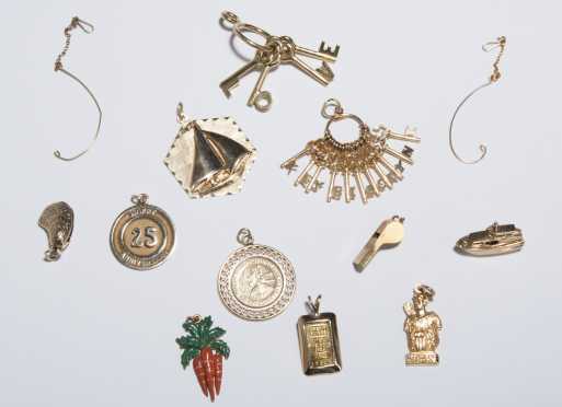 Eleven Yellow Gold Figural Charms.