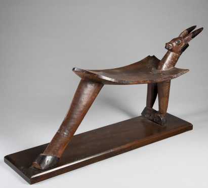 A Lobi figural stool; by Sikire Kanbire of Gaoua
