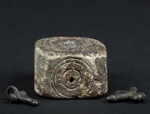 Medieval Inkwell and Two Priapic Amulets