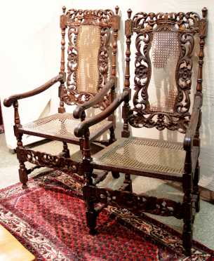 Pair of ornately carved wooden tall back Italian arm chairs