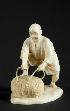 Bone Carving of an Old Man with a large roll of rope