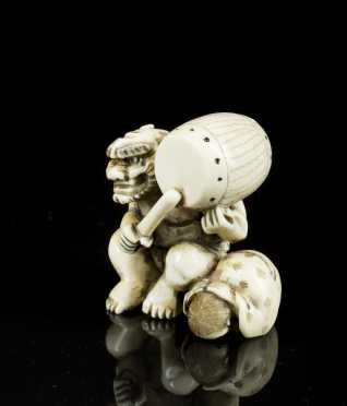 Antique Netsuke, masked man with drum and young boy