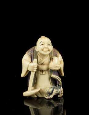 Antique Netsuke, standing man with hoe and cat