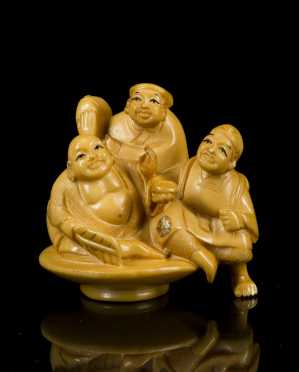 Antique Netsuke, woman and two men seated