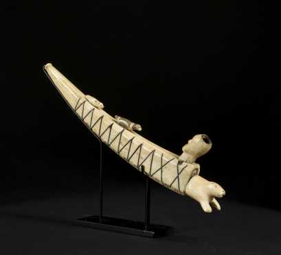 An exceptional Inuit baleen inlaid pipe with elaborate carving. 19th. C