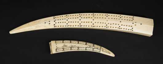Two Inuit cribbage boards
