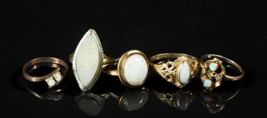 Five Opal Rings set in yellow gold and rose gold