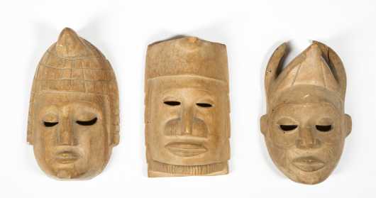 Three decorative Nigerian masks