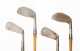 Four Left Handed Wooden Shafted Irons and a Leather & Canvas Bag