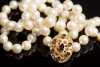 Strand of Pearls with 14Kt. Gold and Garnet Clasp