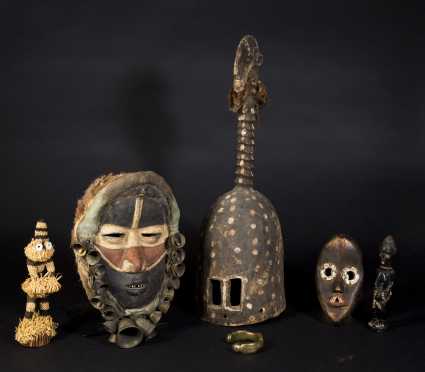 A Group of Decorative African Masks and Objects