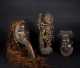A Group of Decorative African Masks and Objects