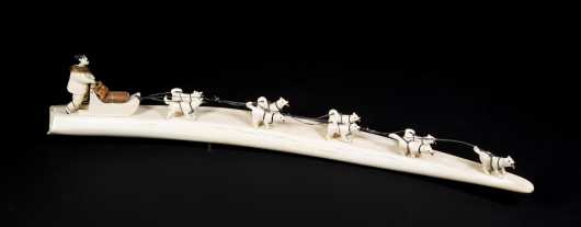 Inuit Carved Walrus Dog Sled on a Tusk