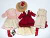 Nine Pieces of Doll's Clothing in Reds and Pinks
