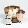 Lot of Two All Bisque Dolls in Basket and Extra Clothing