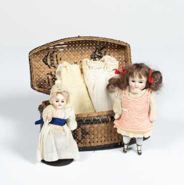 Lot of Two All Bisque Dolls in Basket and Extra Clothing