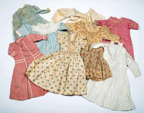 Lot of Eight Doll's Dresses