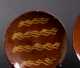 Two Pennsylvania Slip Decorated Redware Dishes