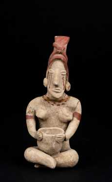 A Delicate Pre Columbian Seated Figure Holding a Bowl