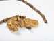 A Pre Columbian Tairona Gold Figural Amulet Necklace