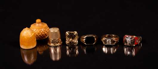 Four Yellow Gold Rings and One 14K Thimble