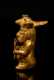 Pre-Columbian Tairona Gold Seated Figure with Two Fan Symbols