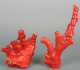Seven Chinese Contemporary Dyed Red Coral Carvings