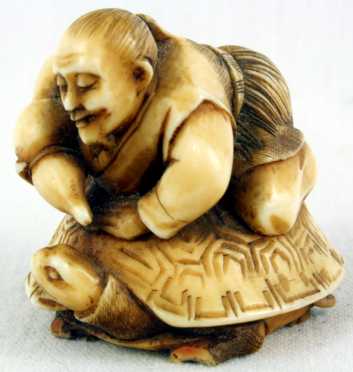 Ivory Katabori Netsuke of a Man Riding a Turtle