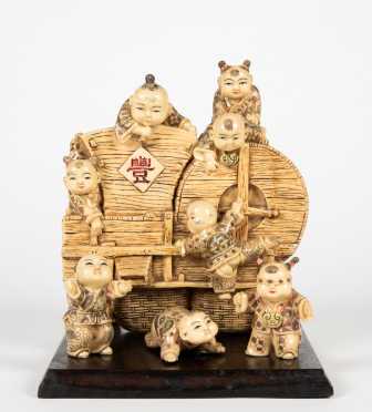 20thC Chinese Resin of Eight Children on a Thrasher