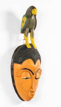 A Painted Yaure Mask with Bird, CÃ´te D'Ivoire
