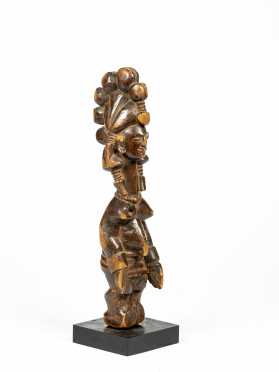 A West African Female Figure with Elaborate Headdress