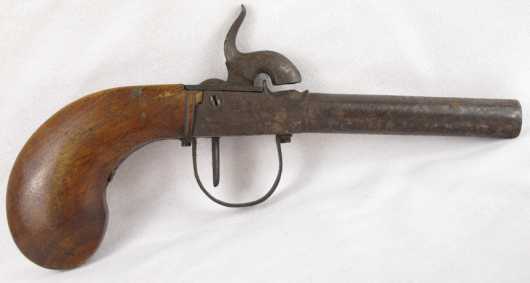 Antique percussion cap pistol with walnut grip