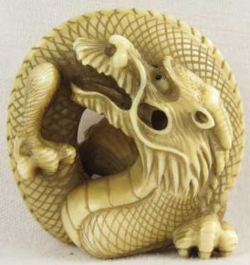 An Ivory Netsuke of a Dragon