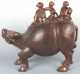 Large Wooden Figural Statue, three figures riding on the back of a water buffalo