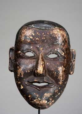 Mask depicting a young monk