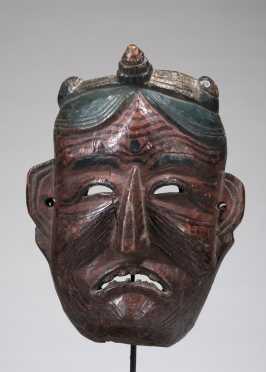 Mask depicting an old grimacing woman